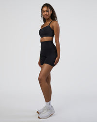 Woman wearing Elixir Ultra High-Rise 6" Short - Black | Model:Jordan | Size:S