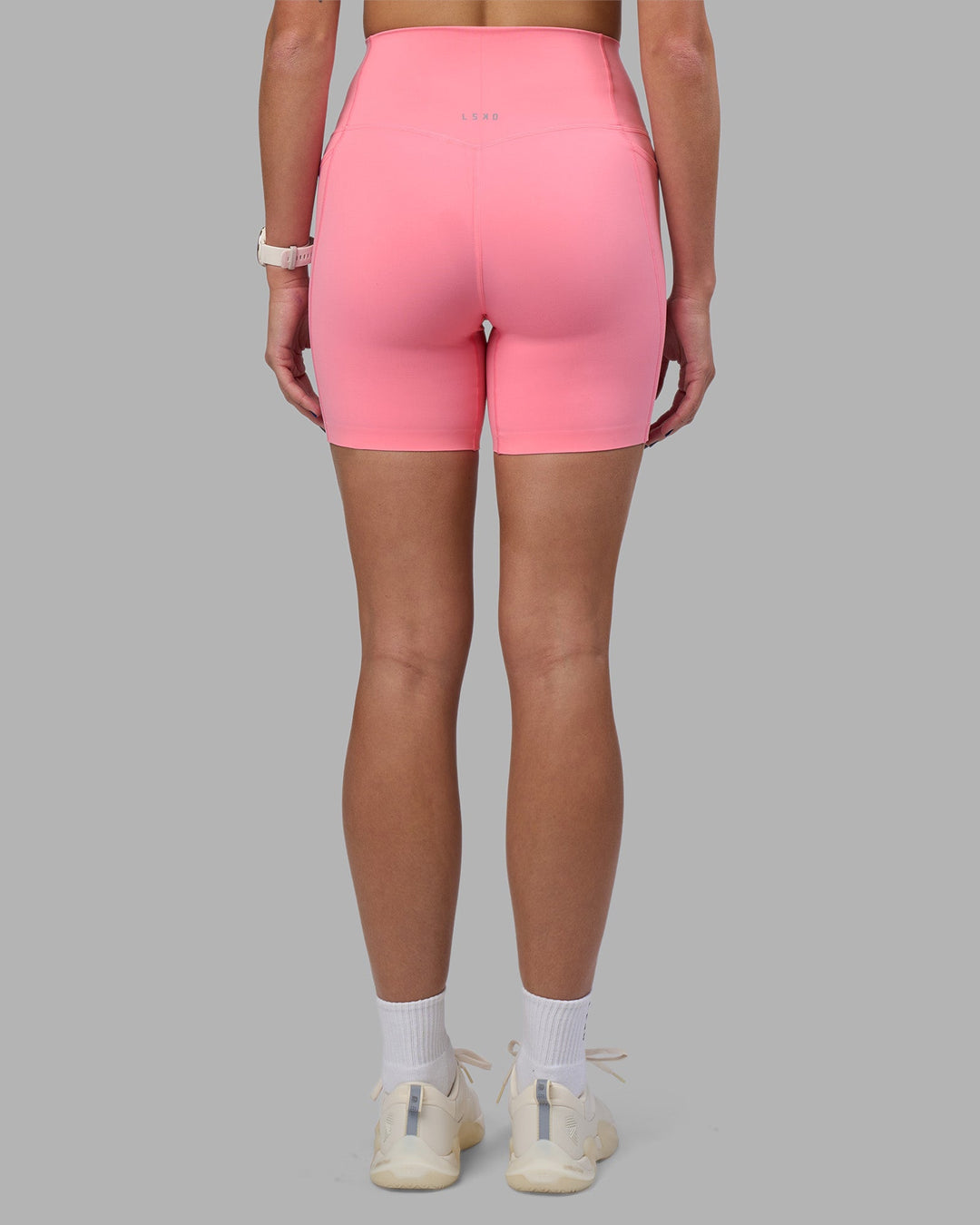 Woman wearing Elixir Ultra High-Rise 6&quot; Short Pockets - Candy Pink | Model:Phoebe | Size:S