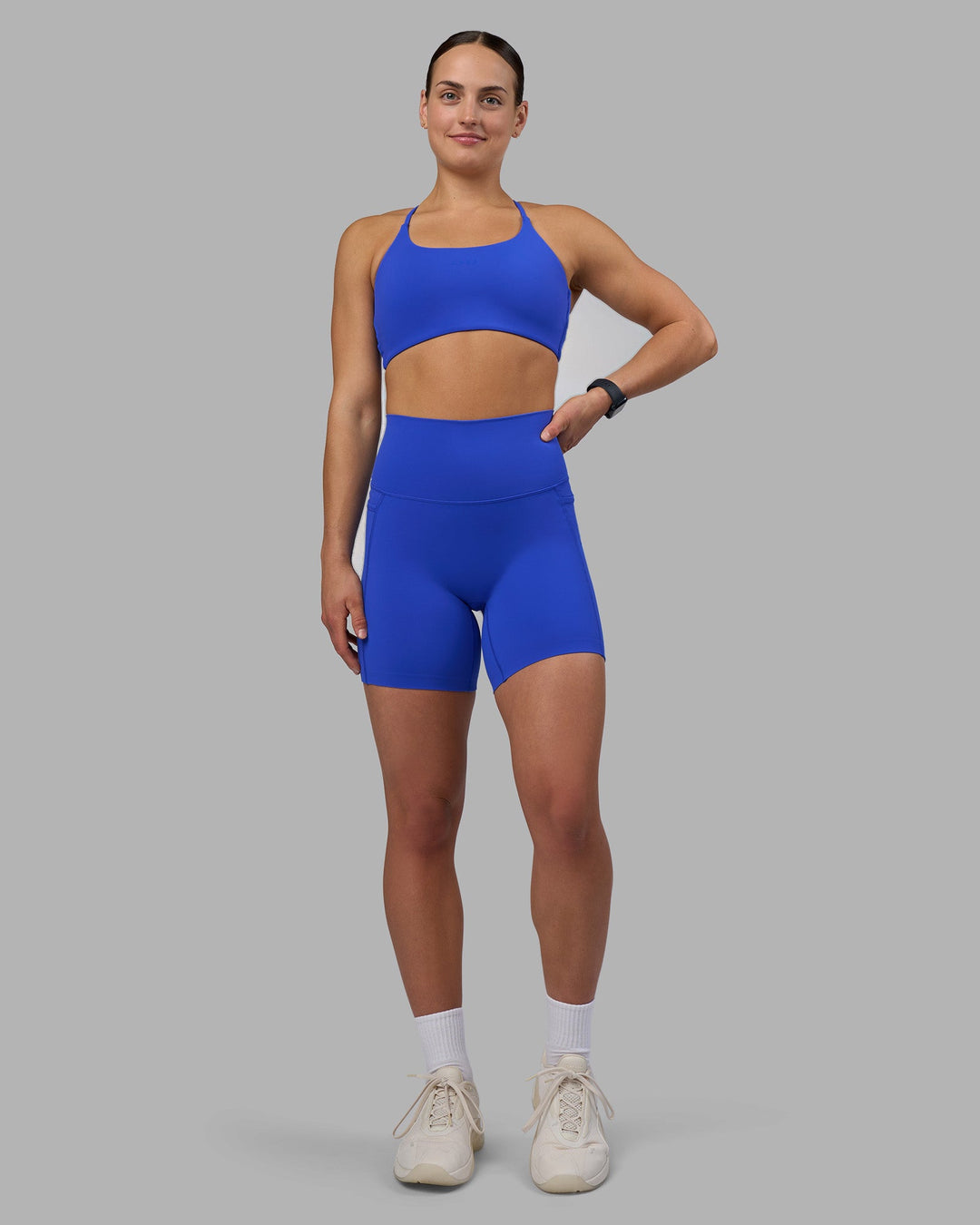 Woman wearing Elixir Ultra High-Rise 6&quot; Short Pockets - Power Cobalt | Model:Keisha | Size:S