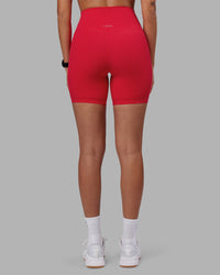 Woman wearing Elixir Ultra High-Rise 6" Short - Scarlet | Model:Rhiley | Size:S