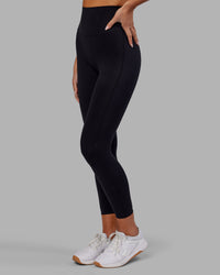 Woman wearing Elixir Ultra High-Rise 7/8 Legging - Black | Model:Kirstyn | Size:S