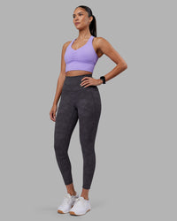 Woman wearing Elixir Ultra High-Rise 7/8 Legging Pockets - Dark Storm Wash | Model:Rhiley | Size:S | Thumbnail Index: 2