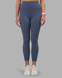 Woman wearing Elixir Ultra High-Rise 7/8 Legging Pockets - Night Shadow | Model:Phoebe | Size:S