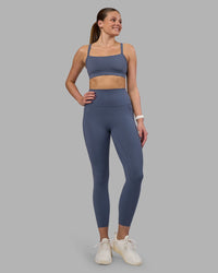 Woman wearing Elixir Ultra High-Rise 7/8 Legging Pockets - Night Shadow | Model:Phoebe | Size:S