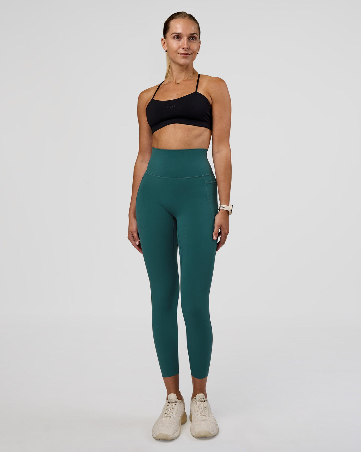 Woman wearing Elixir Ultra High-Rise 7/8 Legging Pockets - Transformative Teal | Model:Myrte | Size:S - view 1