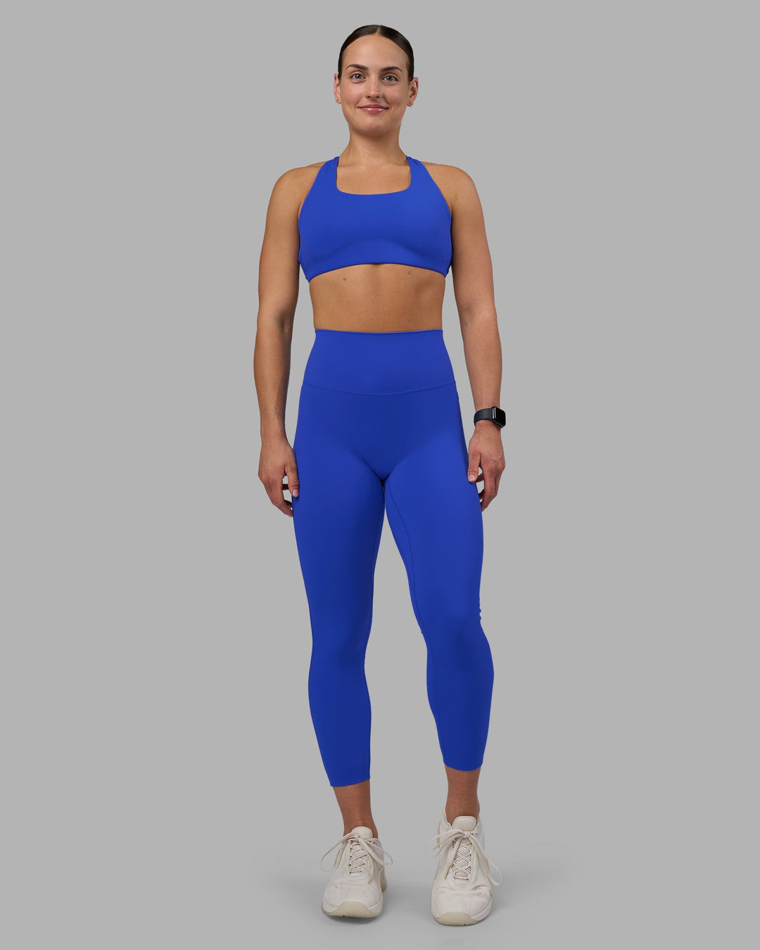 Woman wearing Elixir Ultra High-Rise 7/8 Legging - Power Cobalt | Model:Keisha | Size:S