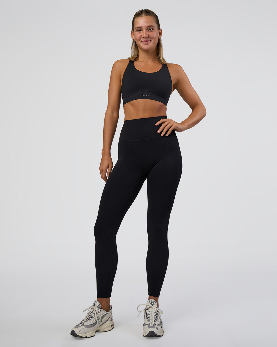 Woman wearing Elixir Ultra High-Rise Full Length Legging - Black | Model:Amity | Size:S