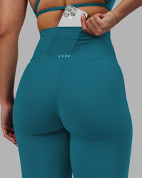 Woman wearing Elixir Ultra High-Rise Full Length Legging - Blue Coral | Model:Ayla | Size:S | Thumbnail Index: 2