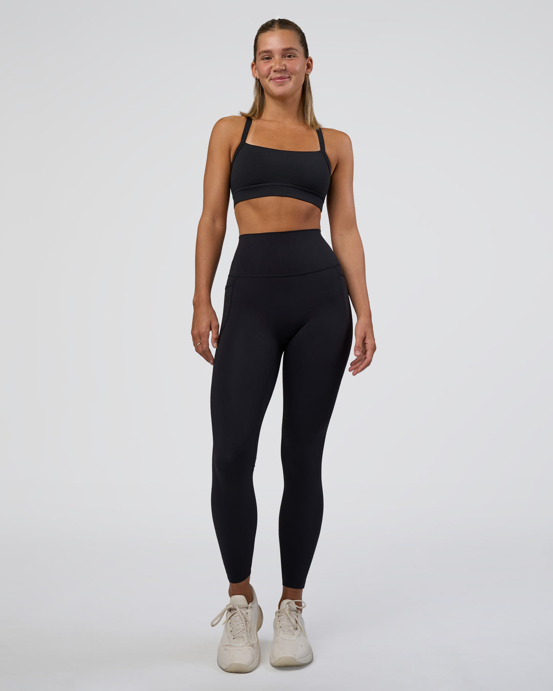 Woman wearing Elixir Ultra High-Rise Full Length Legging Pockets - Black | Model:Amity | Size:S