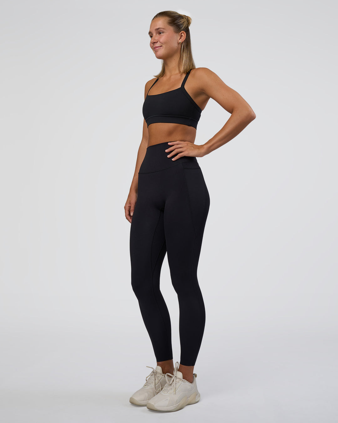 Woman wearing Elixir Ultra High-Rise Full Length Legging Pockets - Black | Model:Amity | Size:S