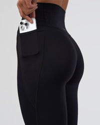 Woman wearing Elixir Ultra High-Rise Full Length Legging Pockets - Black | Model:Amity | Size:S