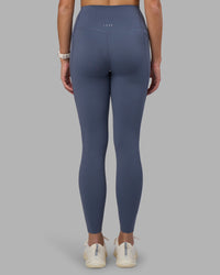 Woman wearing Elixir Ultra High-Rise Full Length Legging Pockets - Night Shadow | Model:Phoebe | Size:S