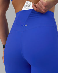 Woman wearing Elixir Ultra High-Rise Full Length Legging - Power Cobalt | Model:Keisha | Size:S | Thumbnail Index: 2