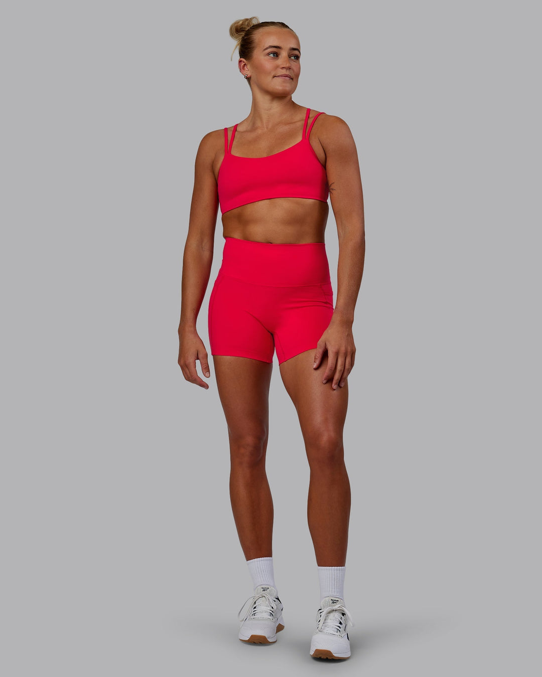 Woman wearing Elixir X-Length Shorts With Pockets - Scarlet