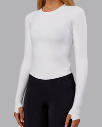 Woman wearing Embrace Thermal Long Sleeve Tee - White | Model:Ella | Size:S