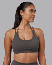 Woman wearing Empower Sports Bra - Dark Storm | Model:Rhiley | Size:S | Thumbnail Index: 0