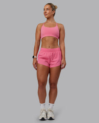 Woman wearing Energy 1.8" Training Short in Pink Lemonade | Model:Lyss | Size:S