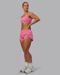 Woman wearing Energy 1.8" Training Short in Pink Lemonade | Model:Lyss | Size:S