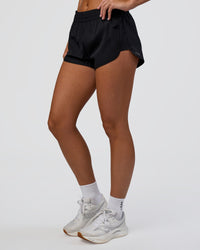 Woman wearing Energy 1.8" Training Short - Black | Model:Amity | Size:S
