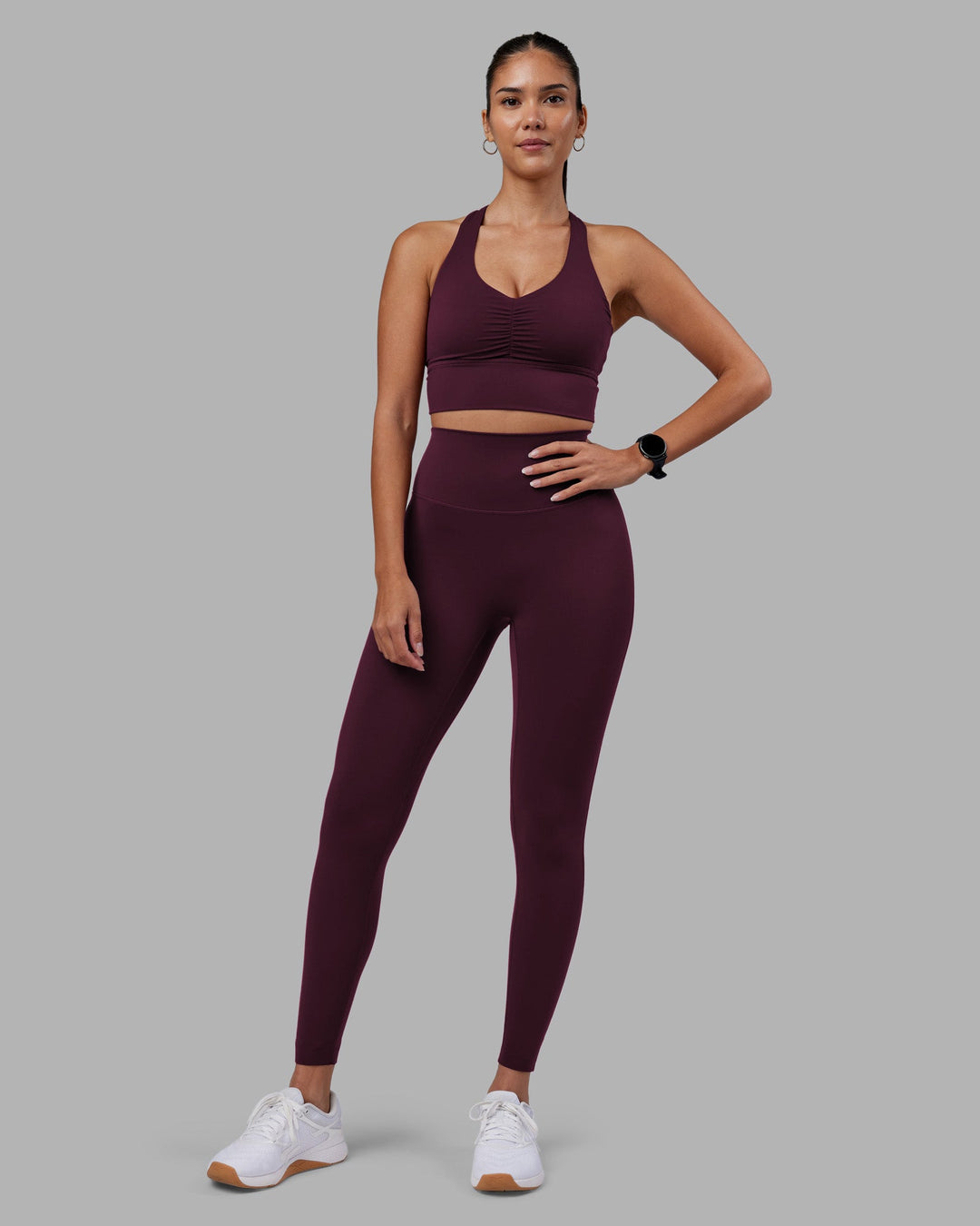 Woman wearing Evoke Longline Sports Bra - Cherry Lacquer | Model:Rhiley | Size:S