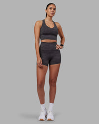 Woman wearing Evoke Longline Sports Bra - Dark Storm Wash | Model:Rhiley | Size:S | Thumbnail Index: 4