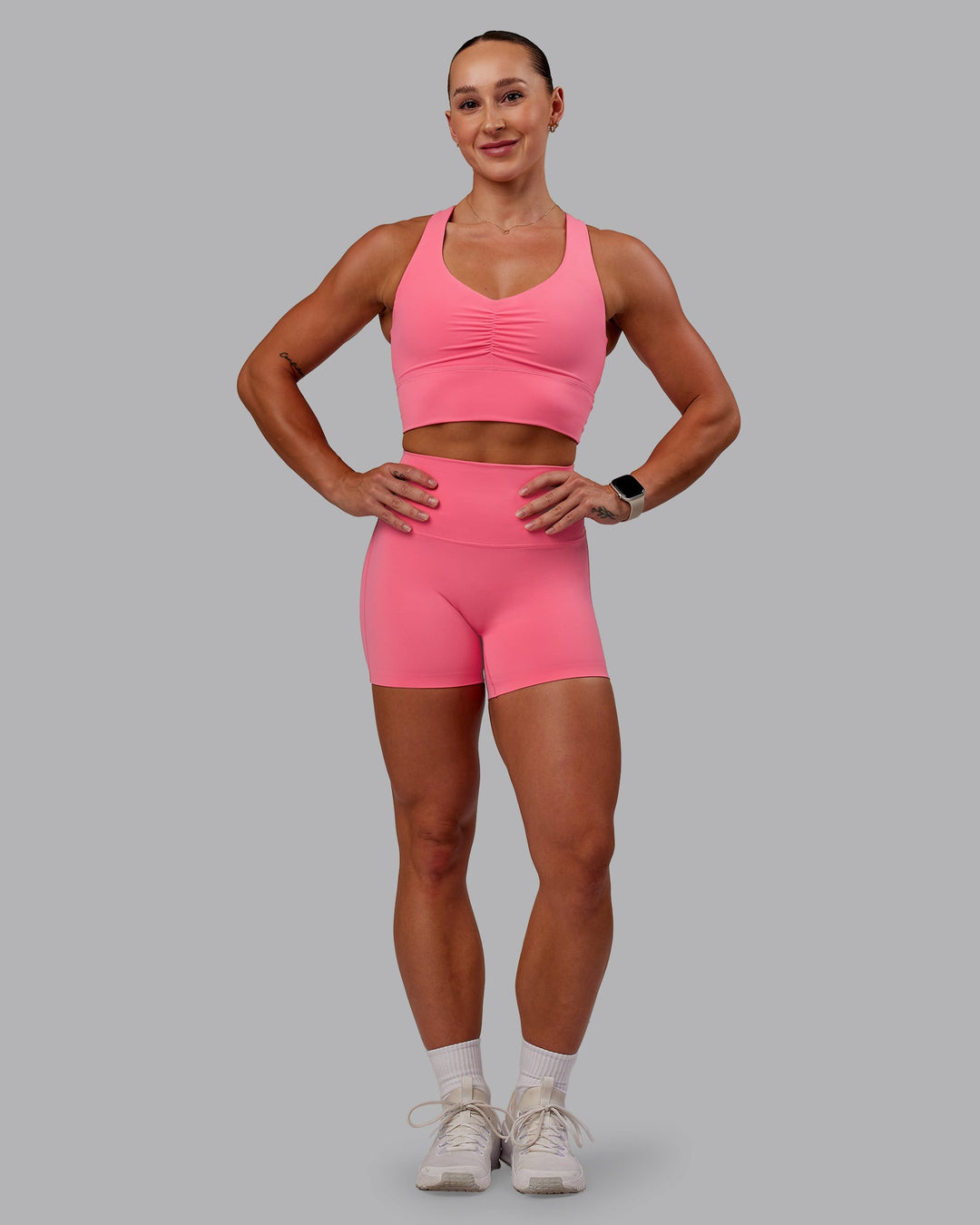 Woman wearing Evoke Sports Bra in Pink Lemonade | Size:S