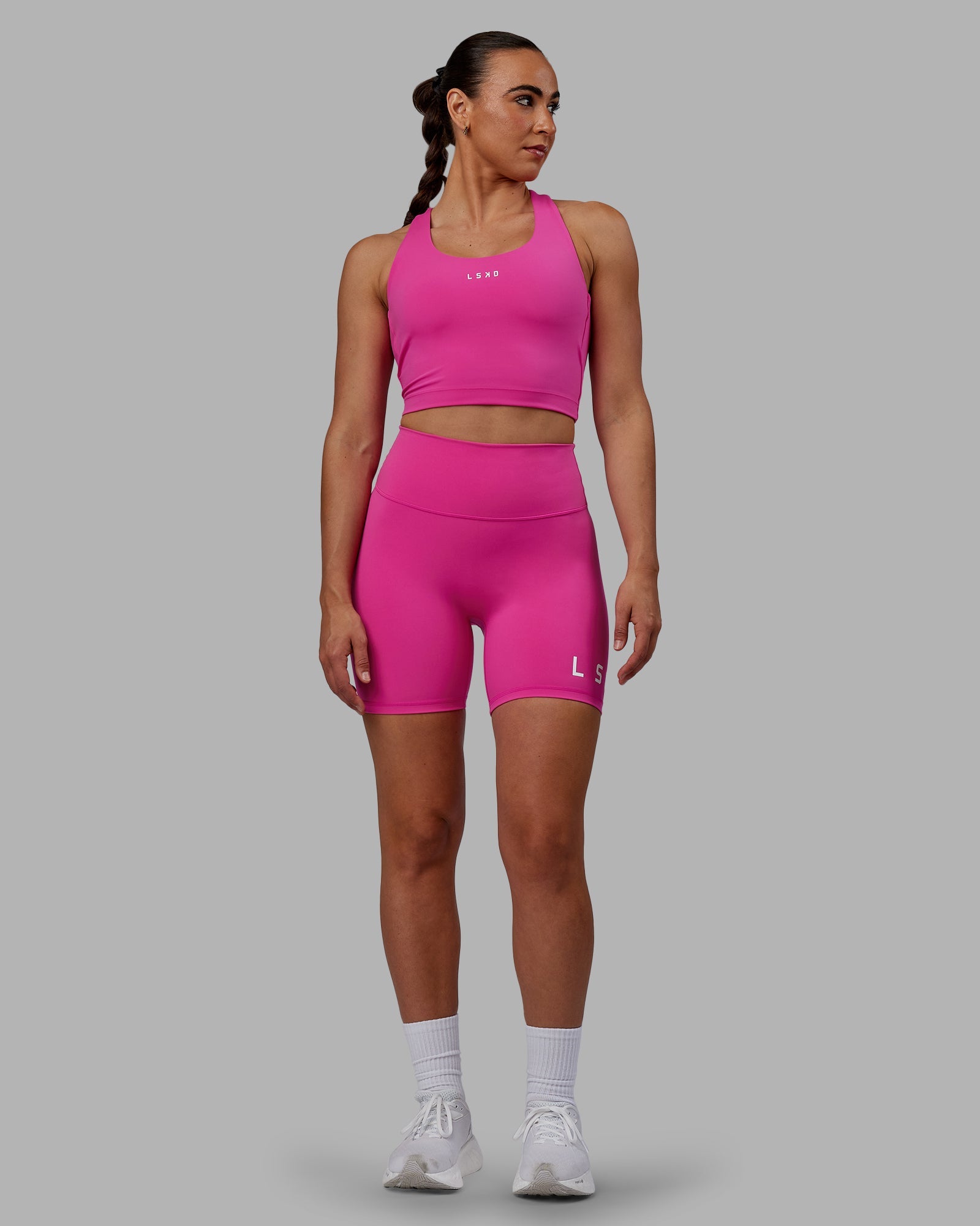 Woman wearing Evolved Ultra High-Rise 6" Short - Fuchsia Pink-White