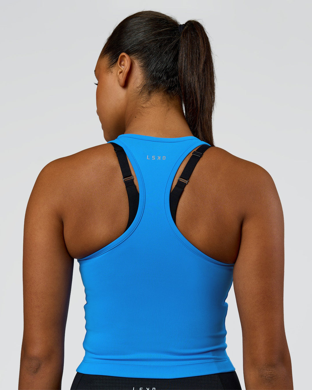 Woman wearing Flow Performance Tank 2.0 - Palace Blue | Model:Rosie | Size:S