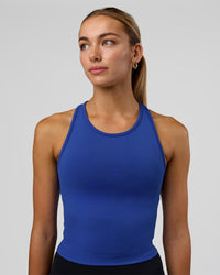 Woman wearing Flow Performance Tank 2.0 - Electric Indigo | Model:Evie | Size:S | Thumbnail Index: 0