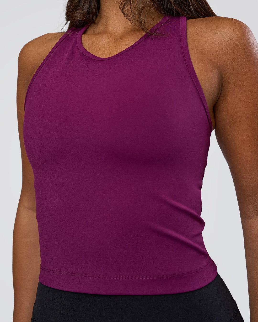 Woman wearing Flow Performance Tank 2.0 - Plum Caspia | Model:Bianca | Size:S