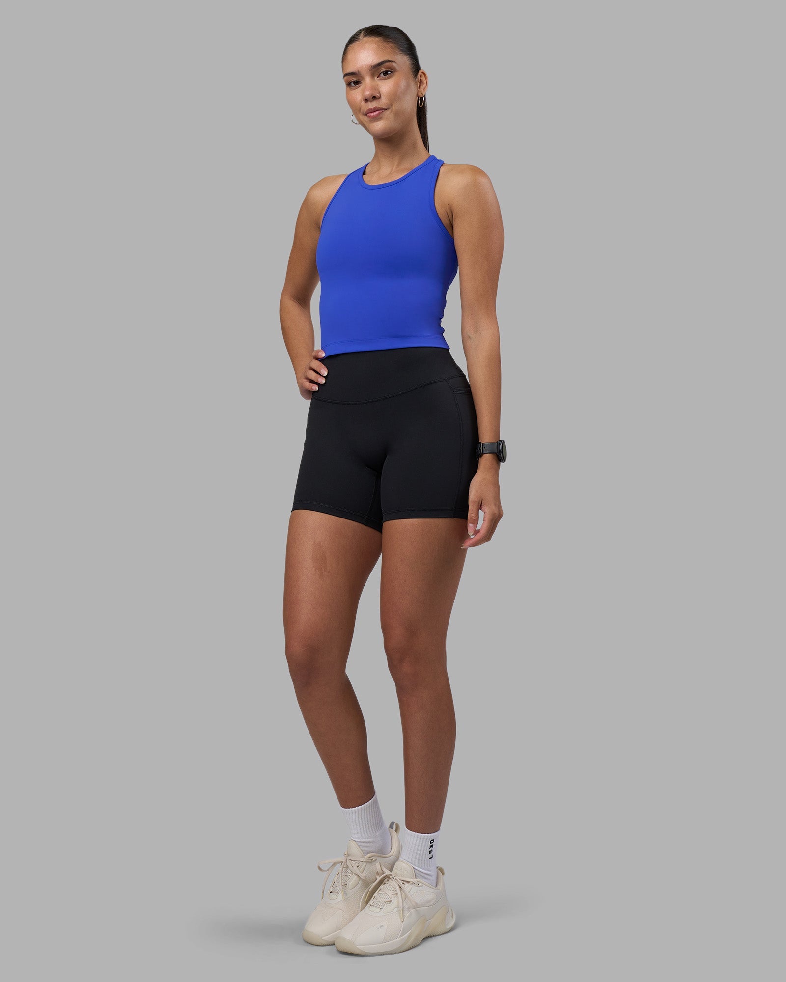 Woman wearing Flow Performance Tank 2.0 - Power Cobalt | Model:Rhiley | Size:S