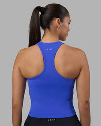 Woman wearing Flow Performance Tank 2.0 - Power Cobalt | Model:Rhiley | Size:S