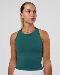 Woman wearing Flow Performance Tank 2.0 - Transformative Teal | Model:Myrte | Size:S | Thumbnail Index: 2