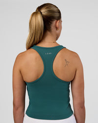 Woman wearing Flow Performance Tank 2.0 - Transformative Teal | Model:Myrte | Size:S | Thumbnail Index: 1