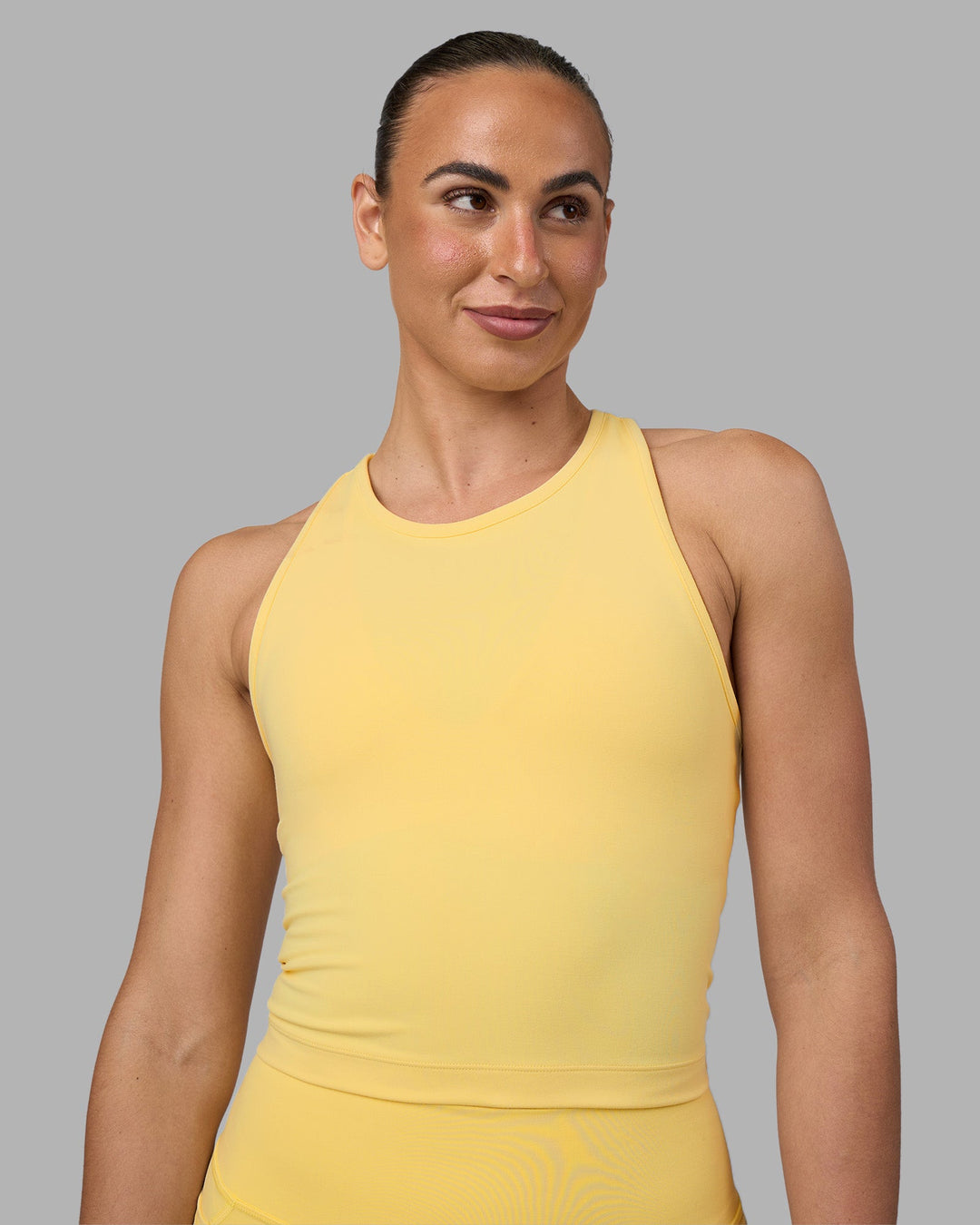 Woman wearing Flow Performance Tank 2.0 - Lemon | Model:Sophie | Size:S
