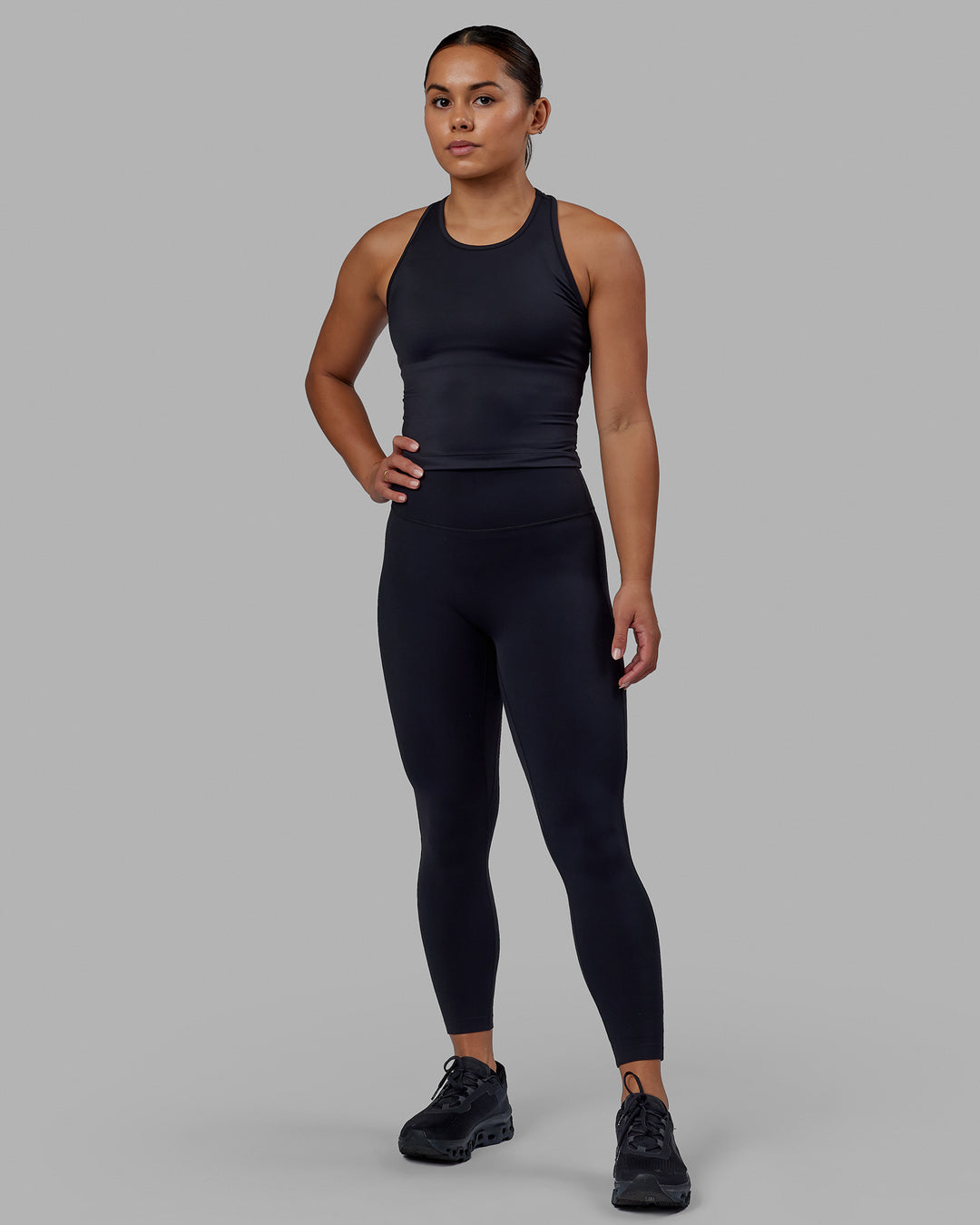 Woman wearing Flow Performance Tank - Black | Model:Xantheia | Size:S