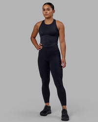 Woman wearing Flow Performance Tank - Black | Model:Xantheia | Size:S