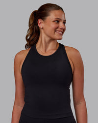 Woman wearing Flow Performance Tank - Black | Model:Phoebe | Size:S
