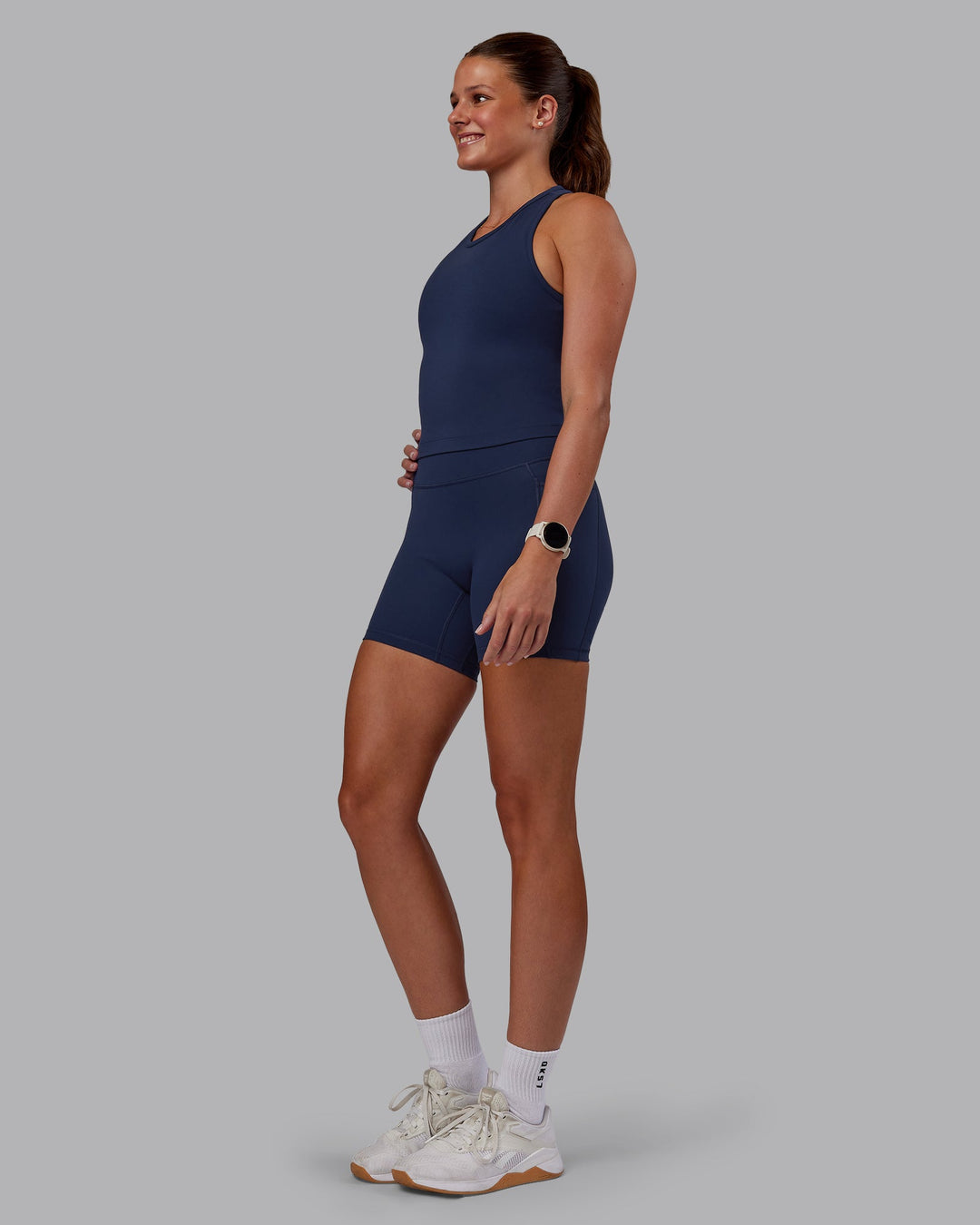 Woman wearing Flow Performance Tank - Future Navy | Model:Phoebe | Size:S