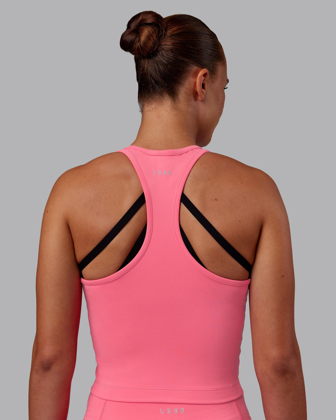 Woman wearing Flow Performance Tank - Pink Lemonade | Model:Charlize | Size:S