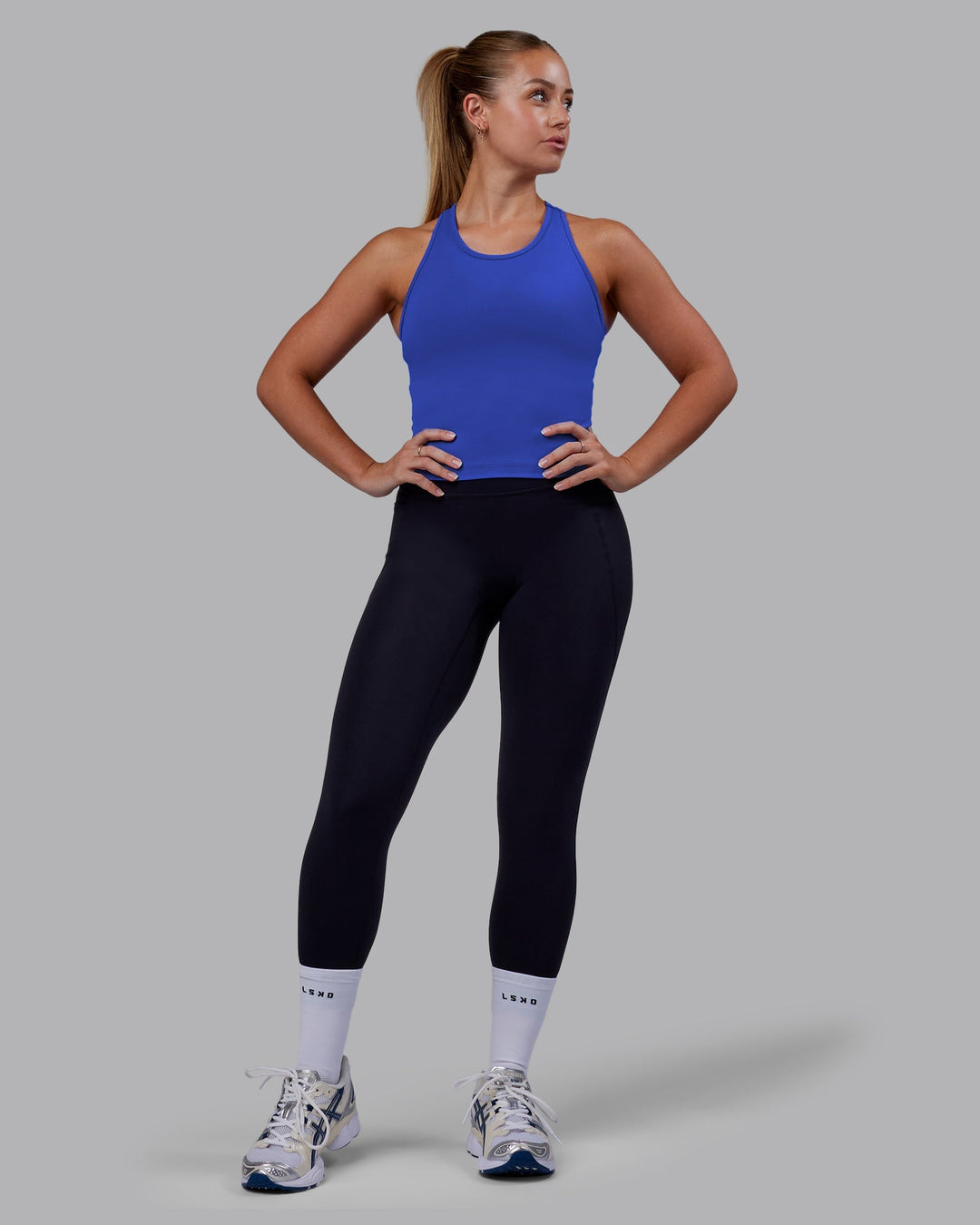 Woman wearing Flow Performance Tank - Power Cobalt