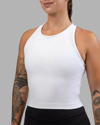 Woman wearing Flow Performance Tank - White | Model:Robyn | Size:S