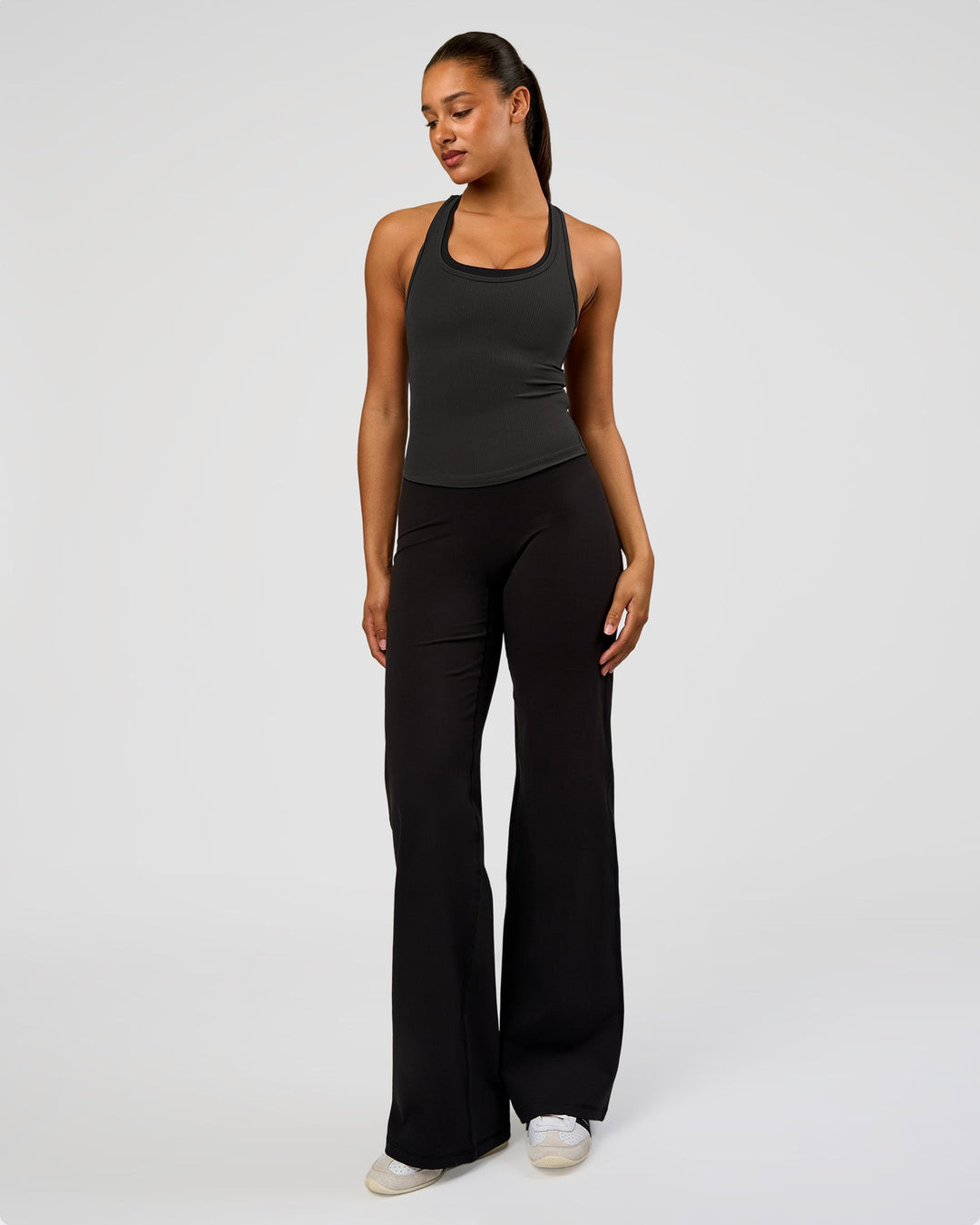 Woman wearing Flow Rib Scoop Neck Tank - Onyx | Model:Rosie | Size:S