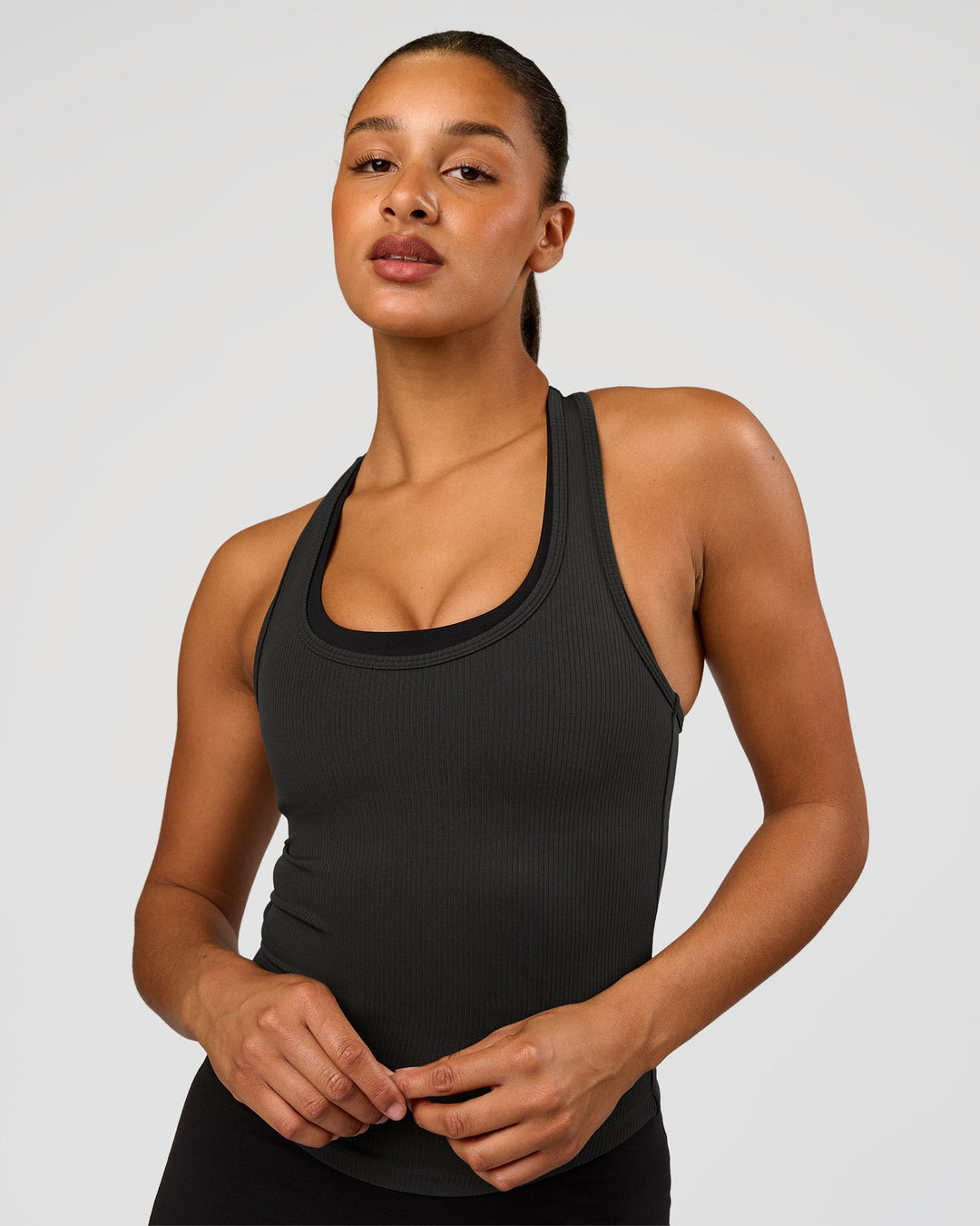 Woman wearing Flow Rib Scoop Neck Tank - Onyx | Model:Rosie | Size:S - view 3