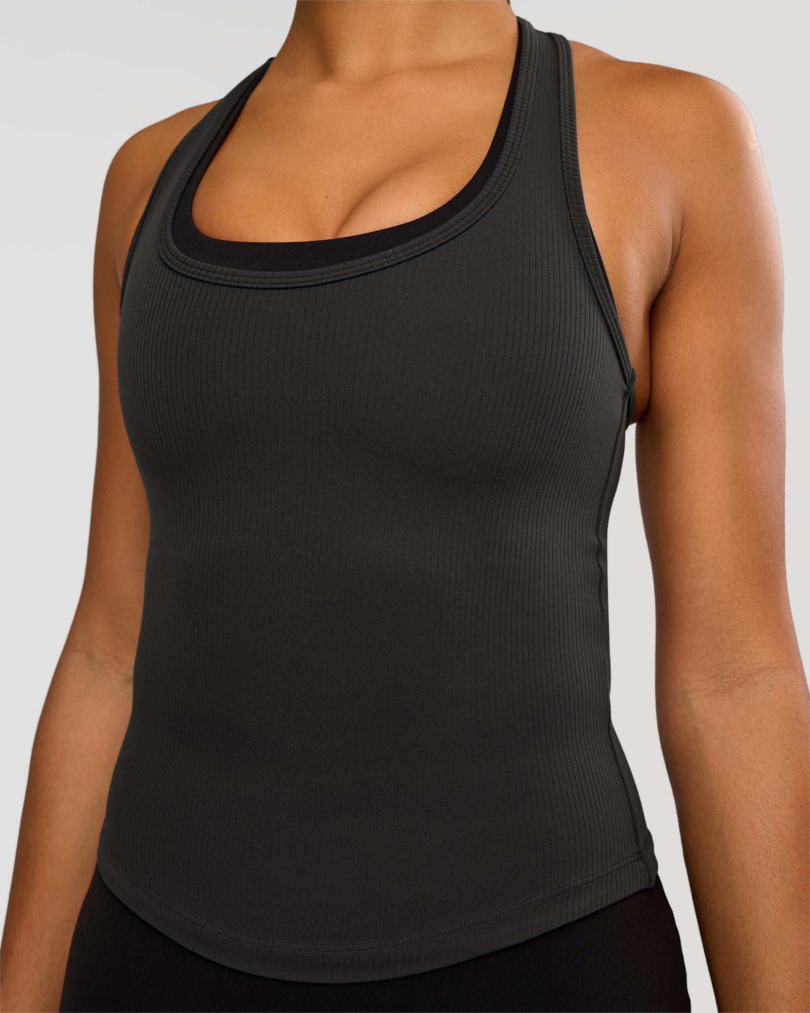 Woman wearing Flow Rib Scoop Neck Tank - Onyx | Model:Rosie | Size:S