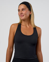 Woman wearing Flow Scoop Neck Performance Tank - Black | Model:Amity | Size:S