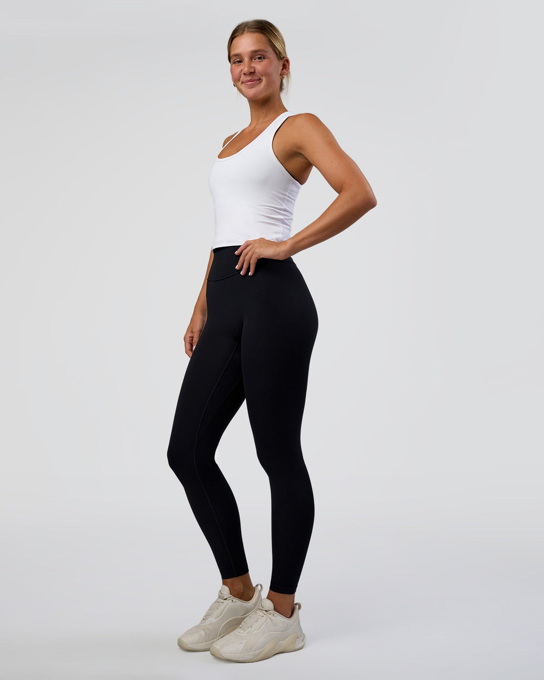 Woman wearing Flow Scoop Neck Performance Tank - White | Model:Amity | Size:S