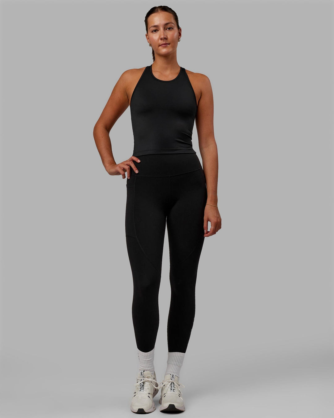 Woman wearing Flow Shelf Bra Performance Tank - Black