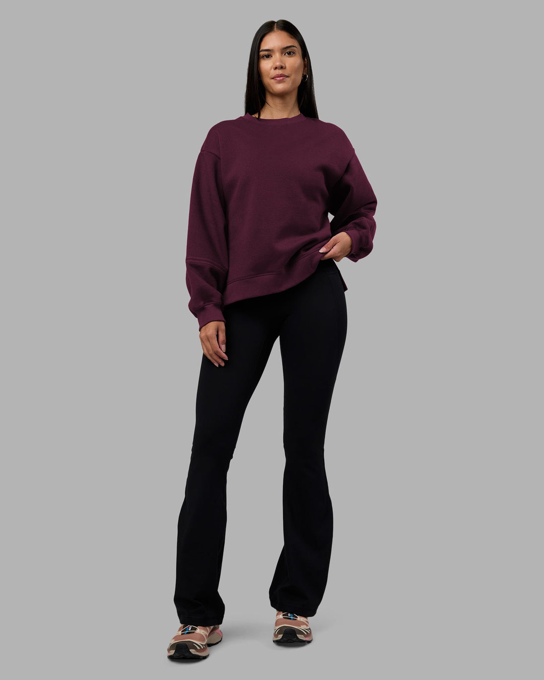 Woman wearing Full Form Fleece Sweater with Side Slits - Cherry Lacquer | Model:Rhiley | Size:S