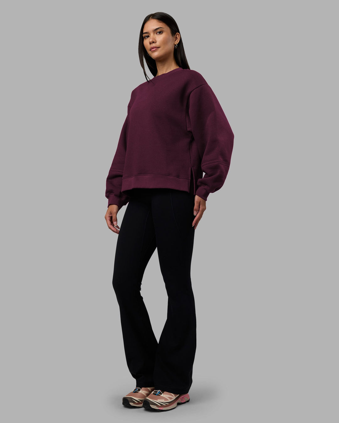 Woman wearing Full Form Fleece Sweater with Side Slits - Cherry Lacquer | Model:Rhiley | Size:S